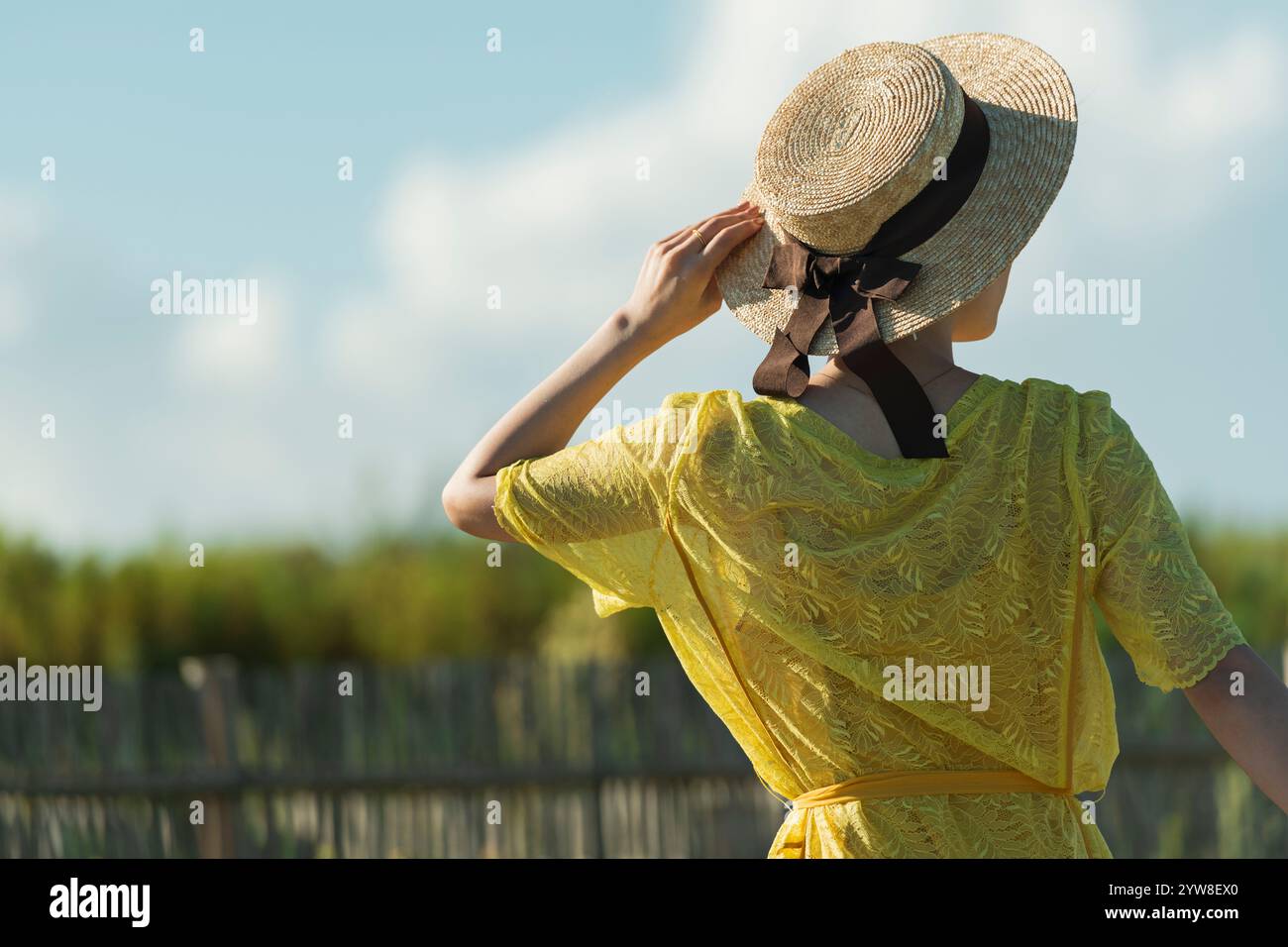 Woman walking on country road Stock Photo - Alamy