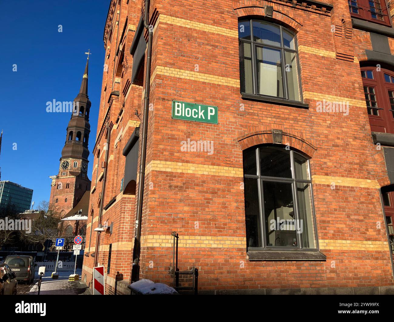 Block P of the The Speicherstadt, with St. Catherine's Church (Hauptkirche St. Katharinen) in the background. Hamburg, Germany. 9th January 2024. - Smartphone Captured Stock Image