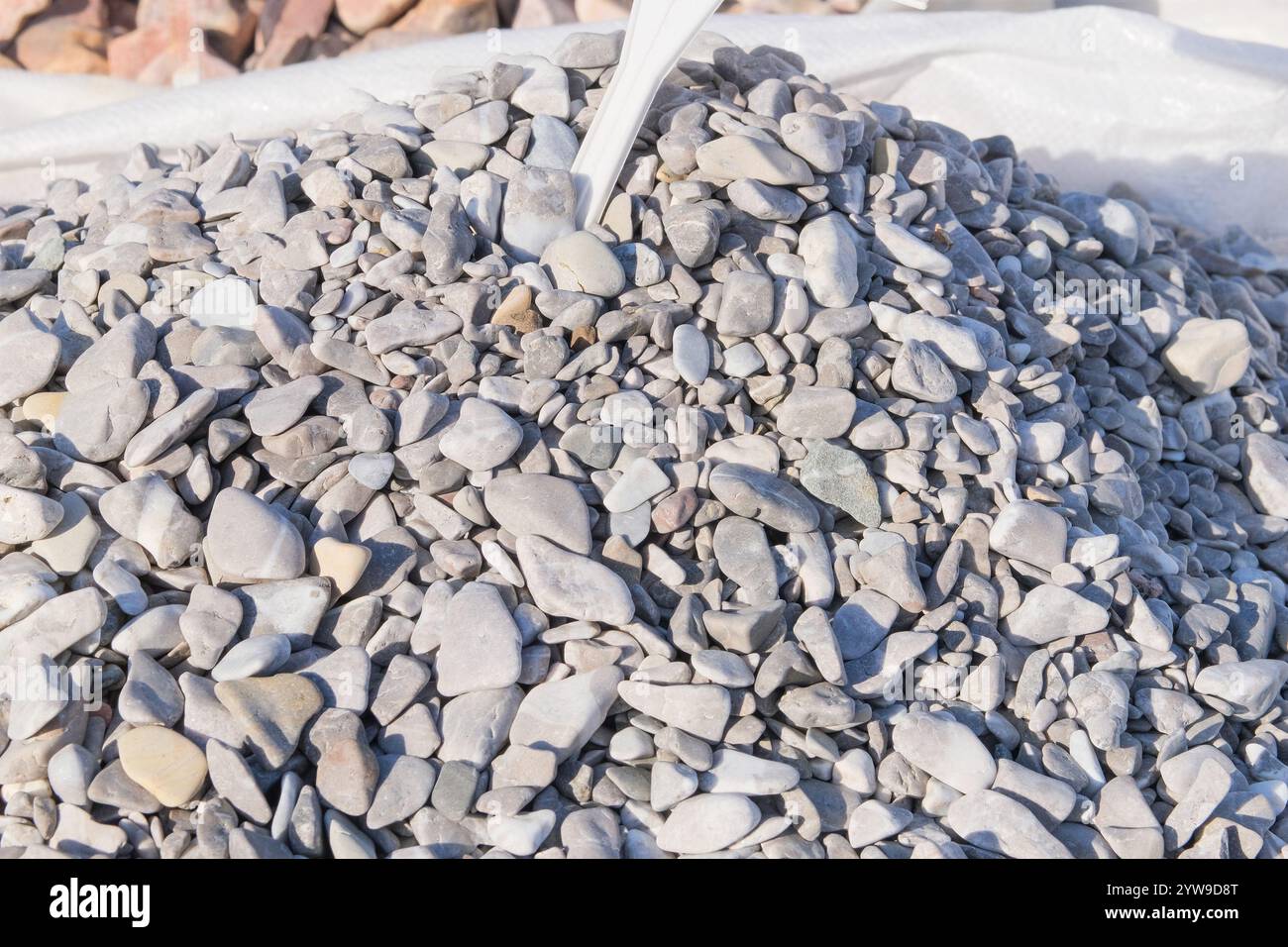 River pebbles. Decorative stones are sold in construction market. Natural stone material for decoration and construction. Stock Photo