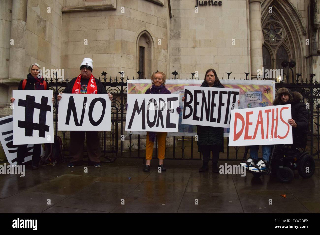 London, UK. 10th December 2024. Protesters gather outside the Royal Courts of Justice as the legal challenge begins against the Department for Work and Pensions' proposed changes to the Work Capability Assessment, which campaign group Disabled People Against Cuts warned would affect people with disabilities. Credit: Vuk Valcic/Alamy Live News Stock Photo