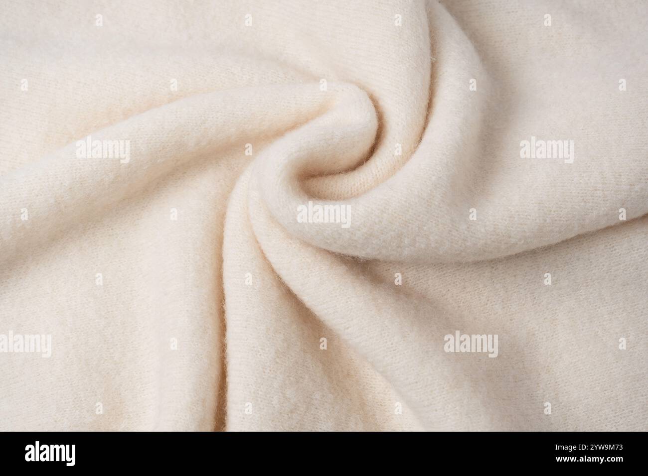Beige sweater texture as a background. Top view. Stock Photo