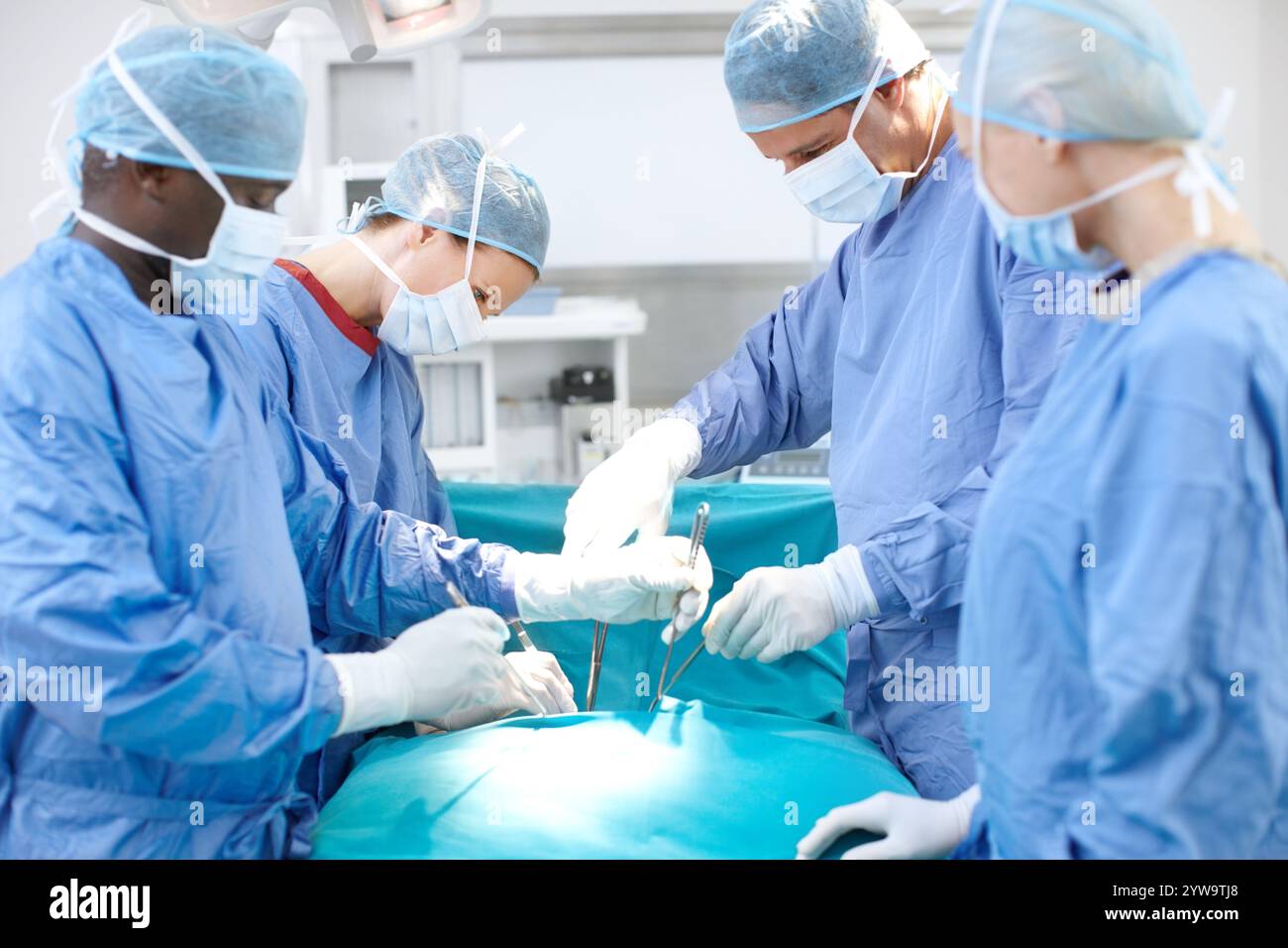 Surgery, team and doctors in operating room together for emergency ...