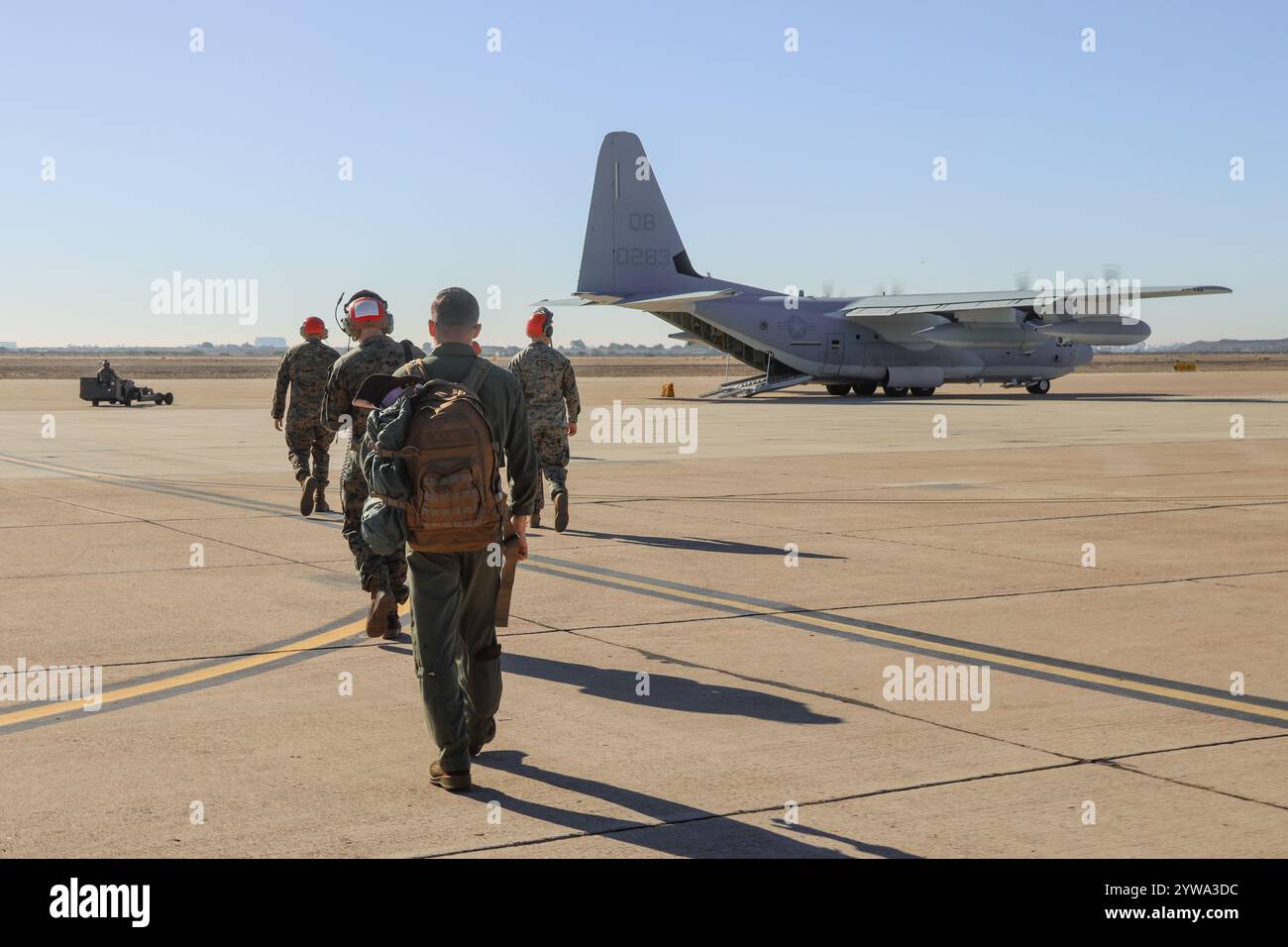 U.S. Marines with Marine Aviation Logistics Squadron 11, Marine Aircraft Group 11, 3rd Marine Aircraft Wing, load onto a KC-130J Super Hercules assign Stock Photo