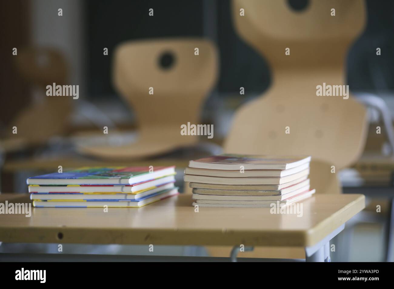 School furniture with textbooks in an empty classroom. Bavaria, Germany, Europe Stock Photo