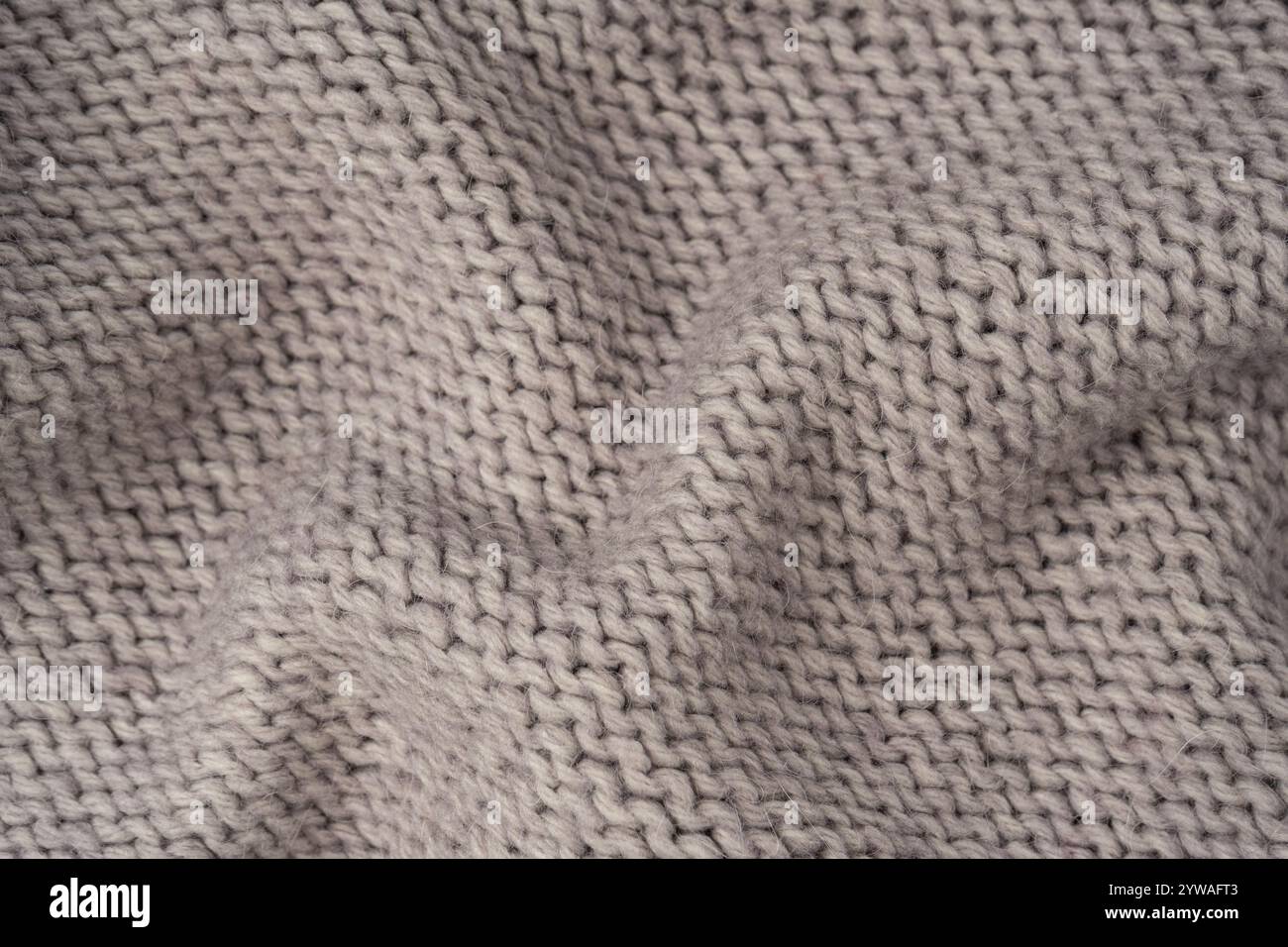 Grey wool sweater texture as a background. Top view. Stock Photo