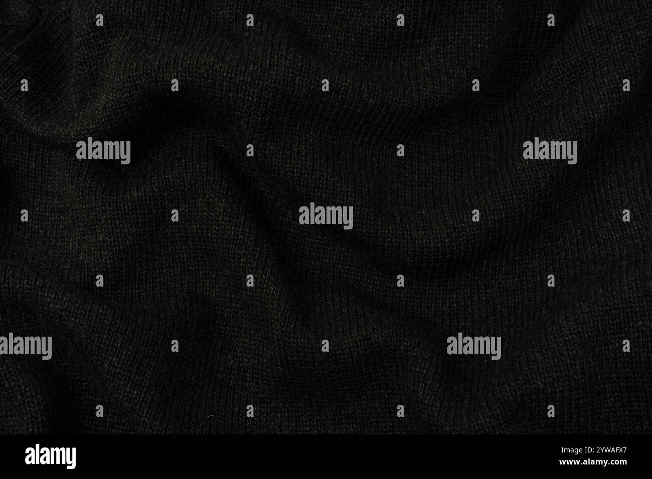 Dark grey sweater texture as a background. Knitted pattern. Top view. Stock Photo
