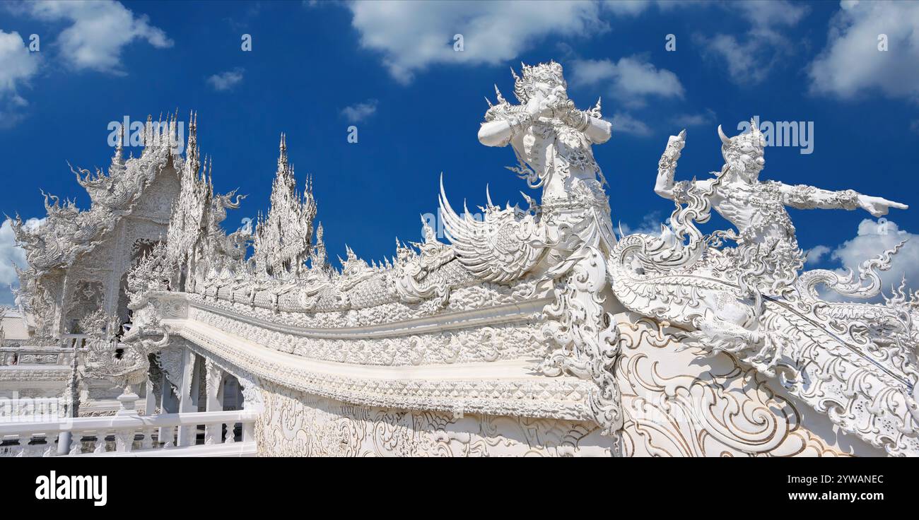 Wat Rong Khun (White Temple) main entrance bridge in a sunny day in Chiang Rai, Thailand Stock Photo