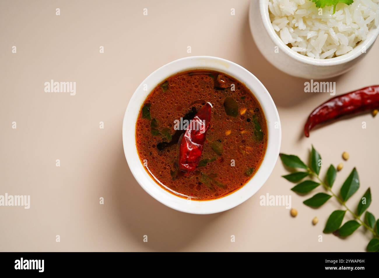 Tomato rasam served with rice, selective focus Stock Photo