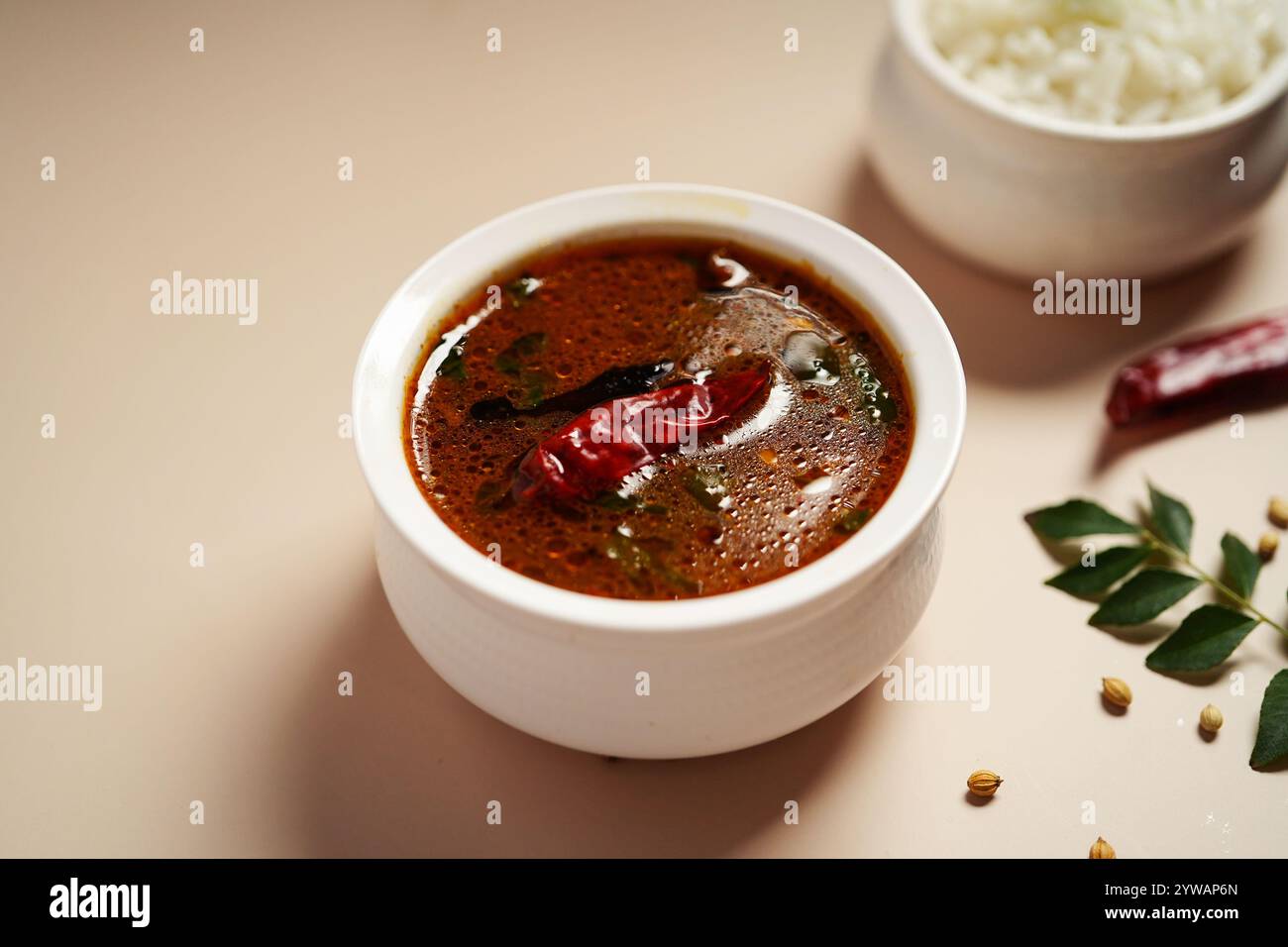 Tomato rasam served with rice, selective focus Stock Photo