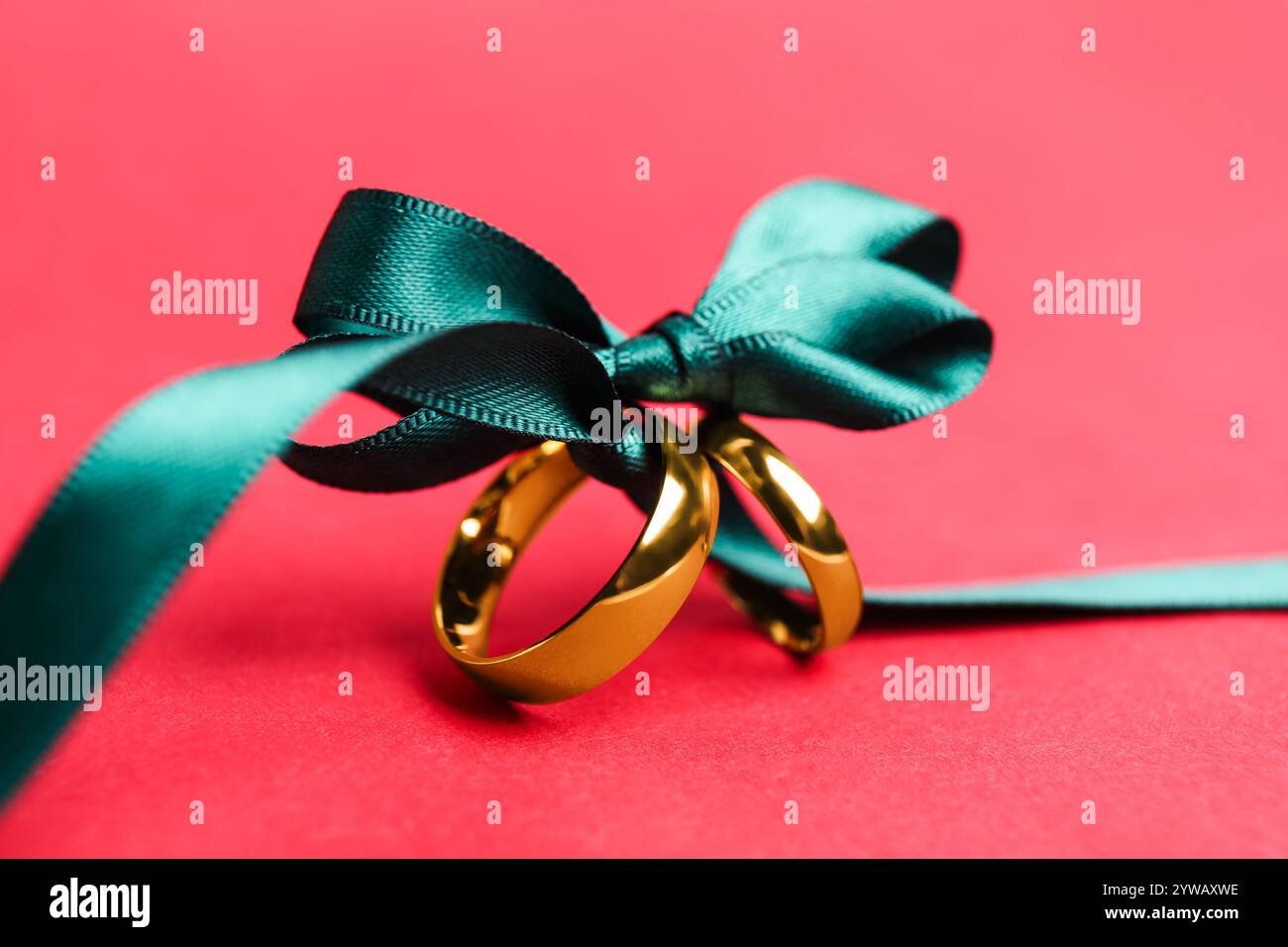 Wedding rings on red bow hi-res stock photography and images - Alamy
