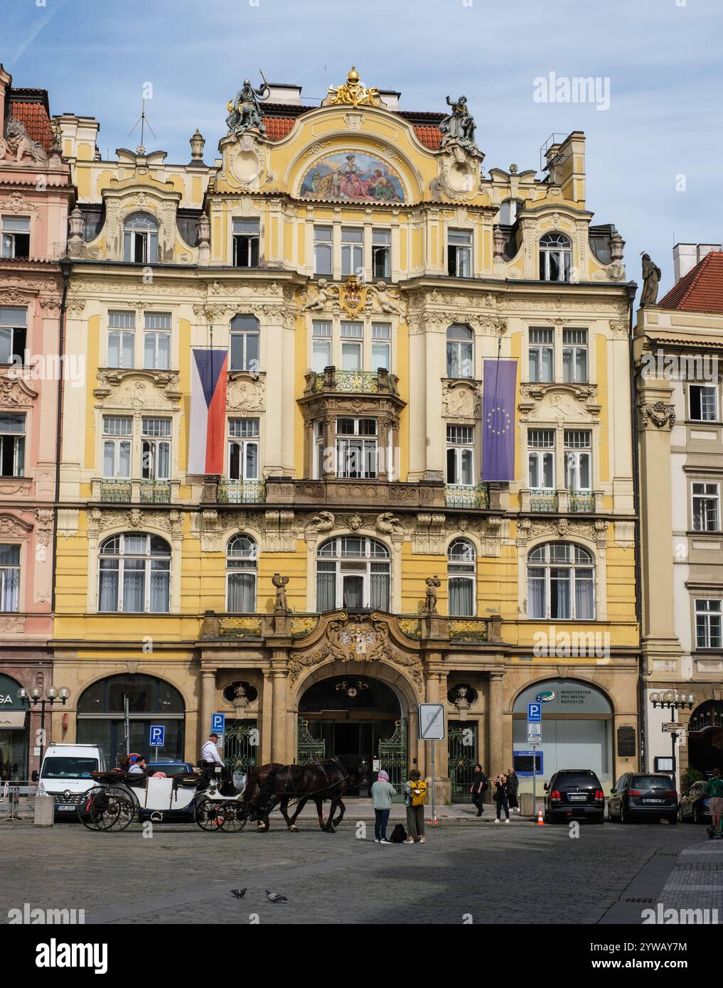 Tourist Carriage Passes Art Nouveau Building Housing Today's Ministry of Regional Development, Old Town Square, Prague, Czechia, Czech Republic. Stock Photo