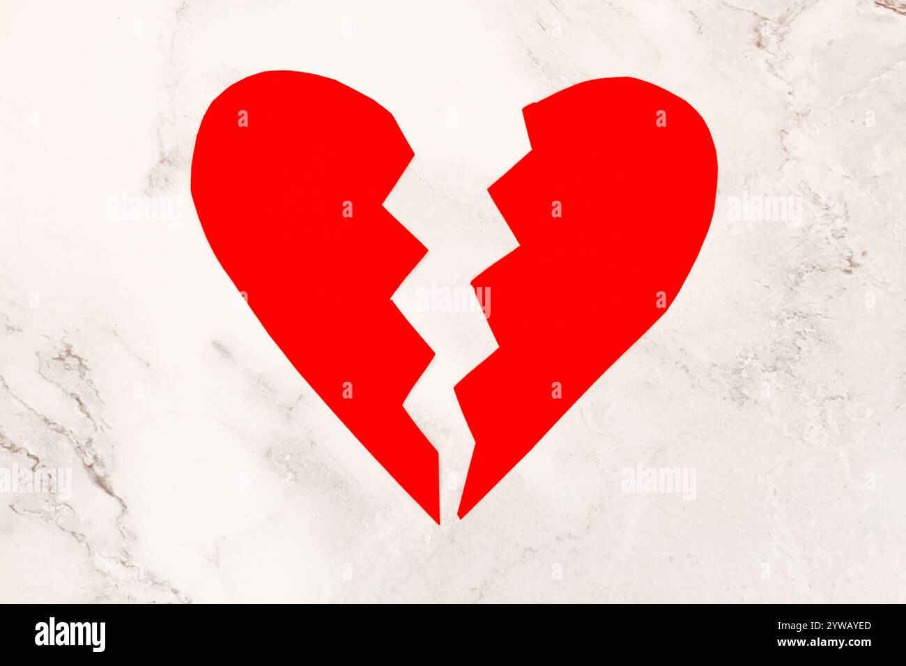 broken red paper heart isolated, concept Stock Photo