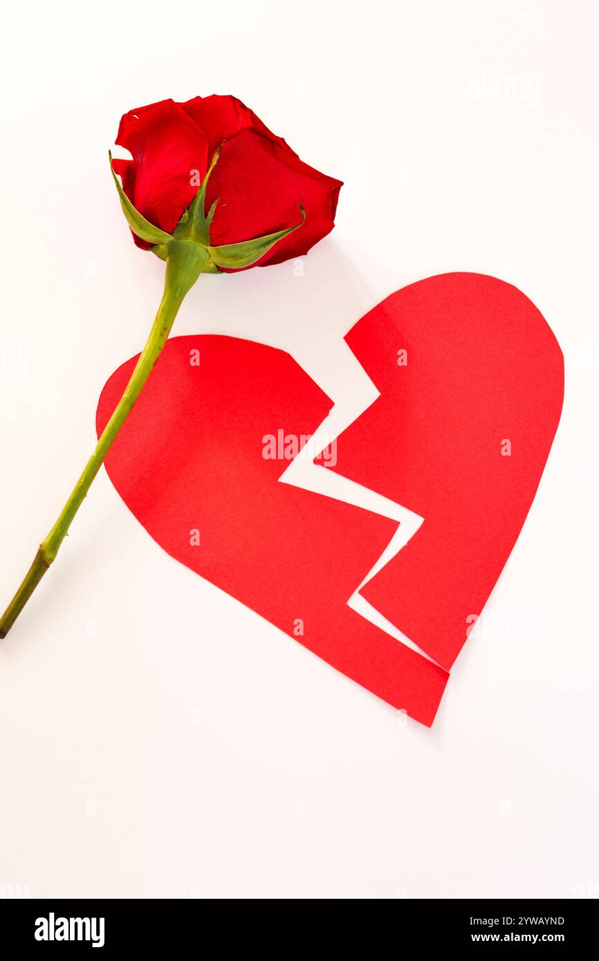 broken red paper heart isolated, concept Stock Photo