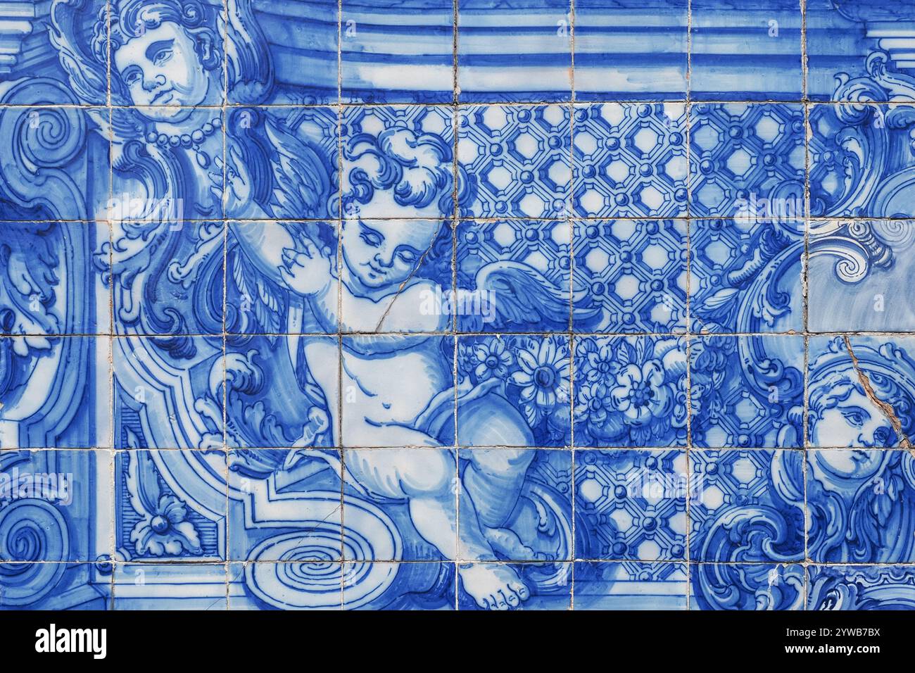 Fragment of ornate exterior facade. Famous Chapel of Souls. The church is covered with blue and white azulejo tiles, with religious scenes and angels. Stock Photo