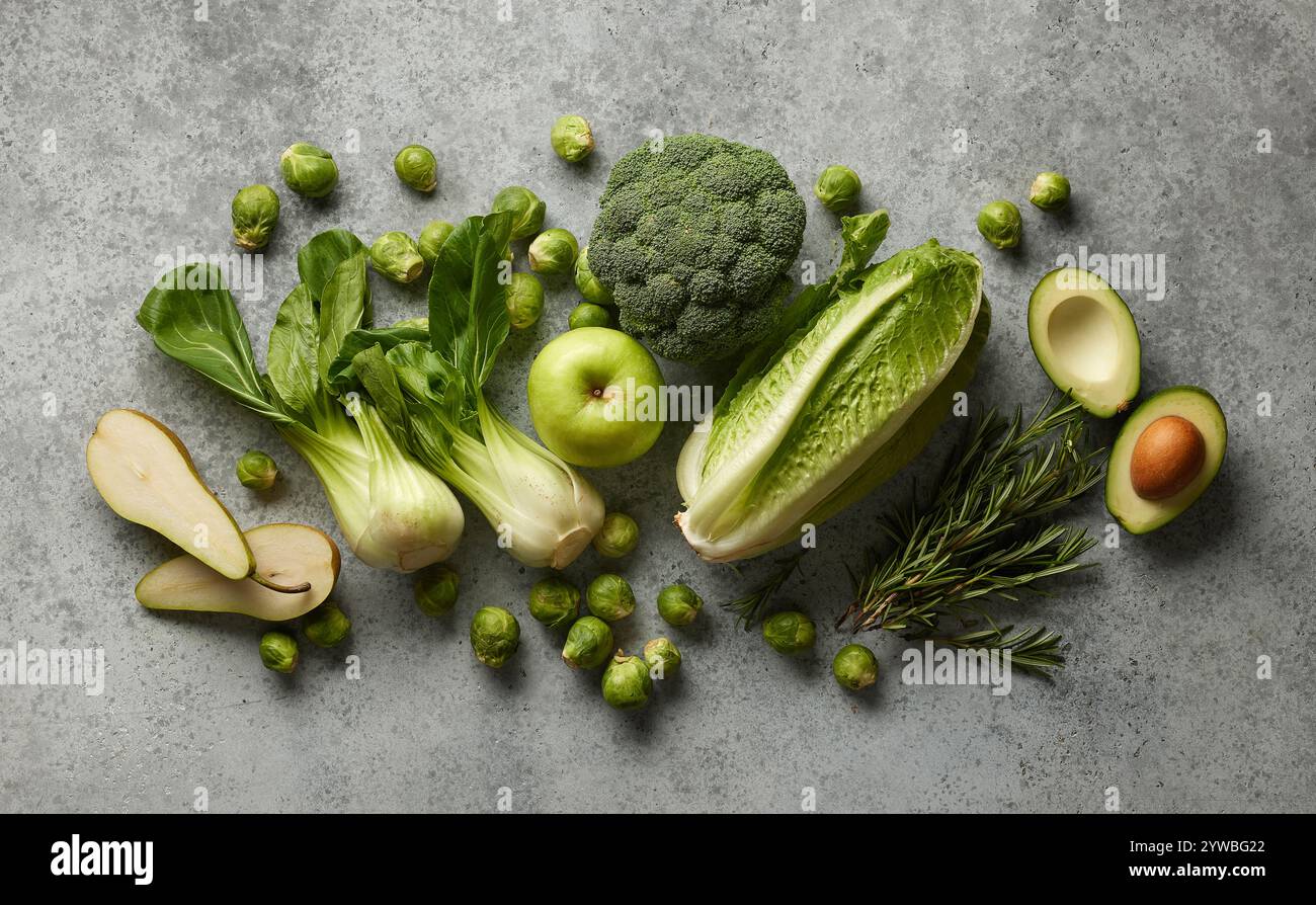 various fresh raw green vegetables on grey table, top view Stock Photo