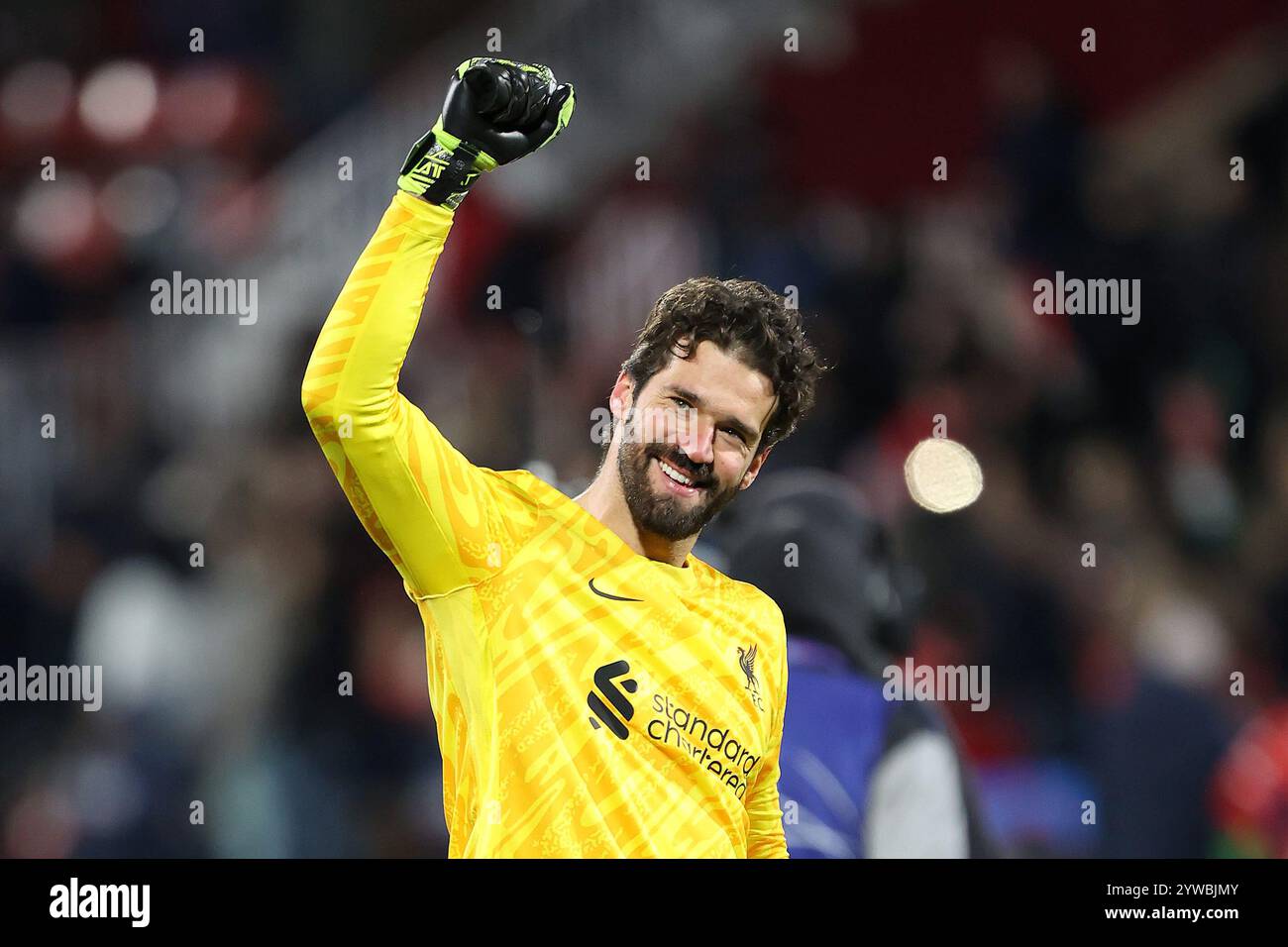Liverpool goalkeeper Alisson Becker gestures to the fans after the UEFA ...