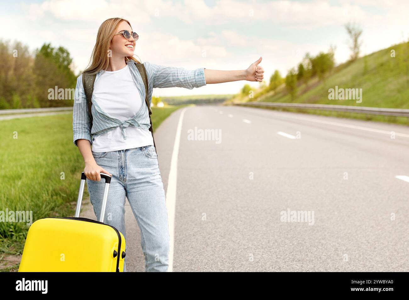 Woman hitching a ride hi-res stock photography and images - Alamy
