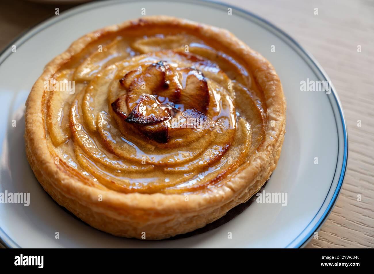 French fresh baked sweet puff pastry with fresh apple fruits in sirup ...