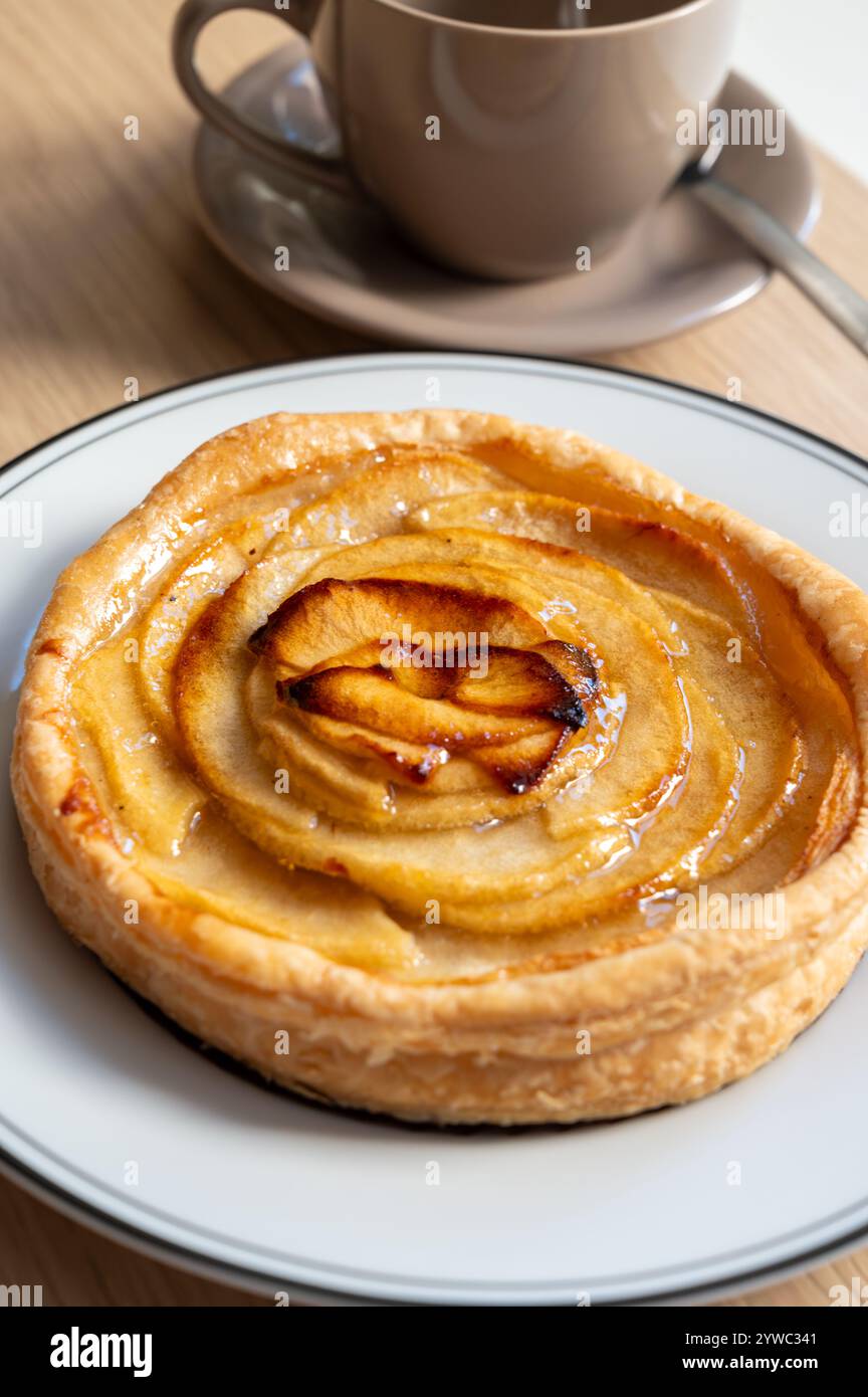 French fresh baked sweet puff pastry with fresh apple fruits in sirup ...