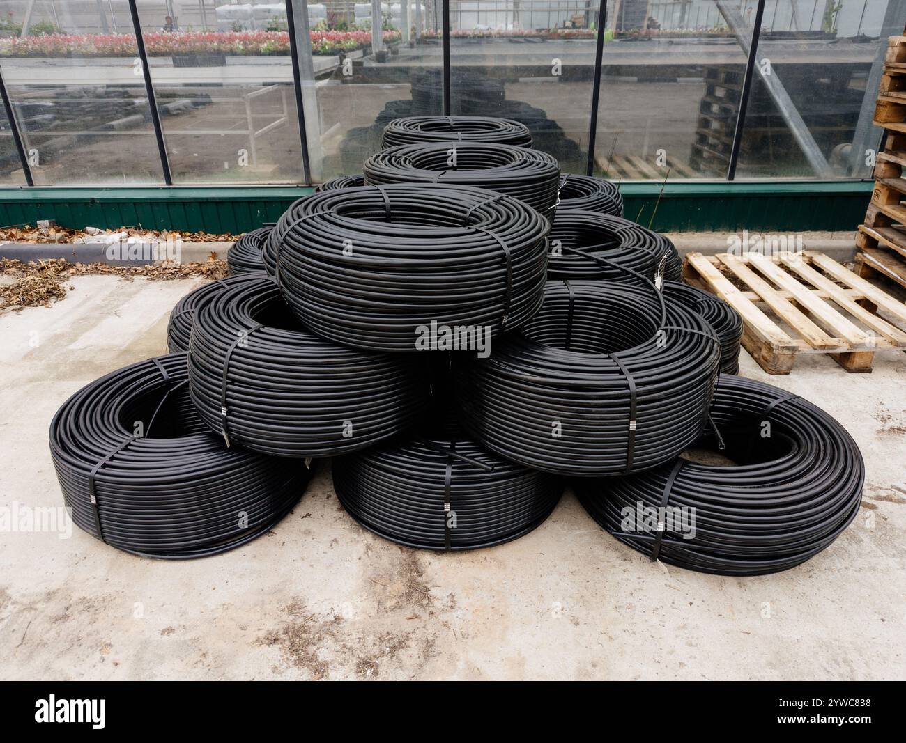 Rolled up black construction wire Stock Photo - Alamy