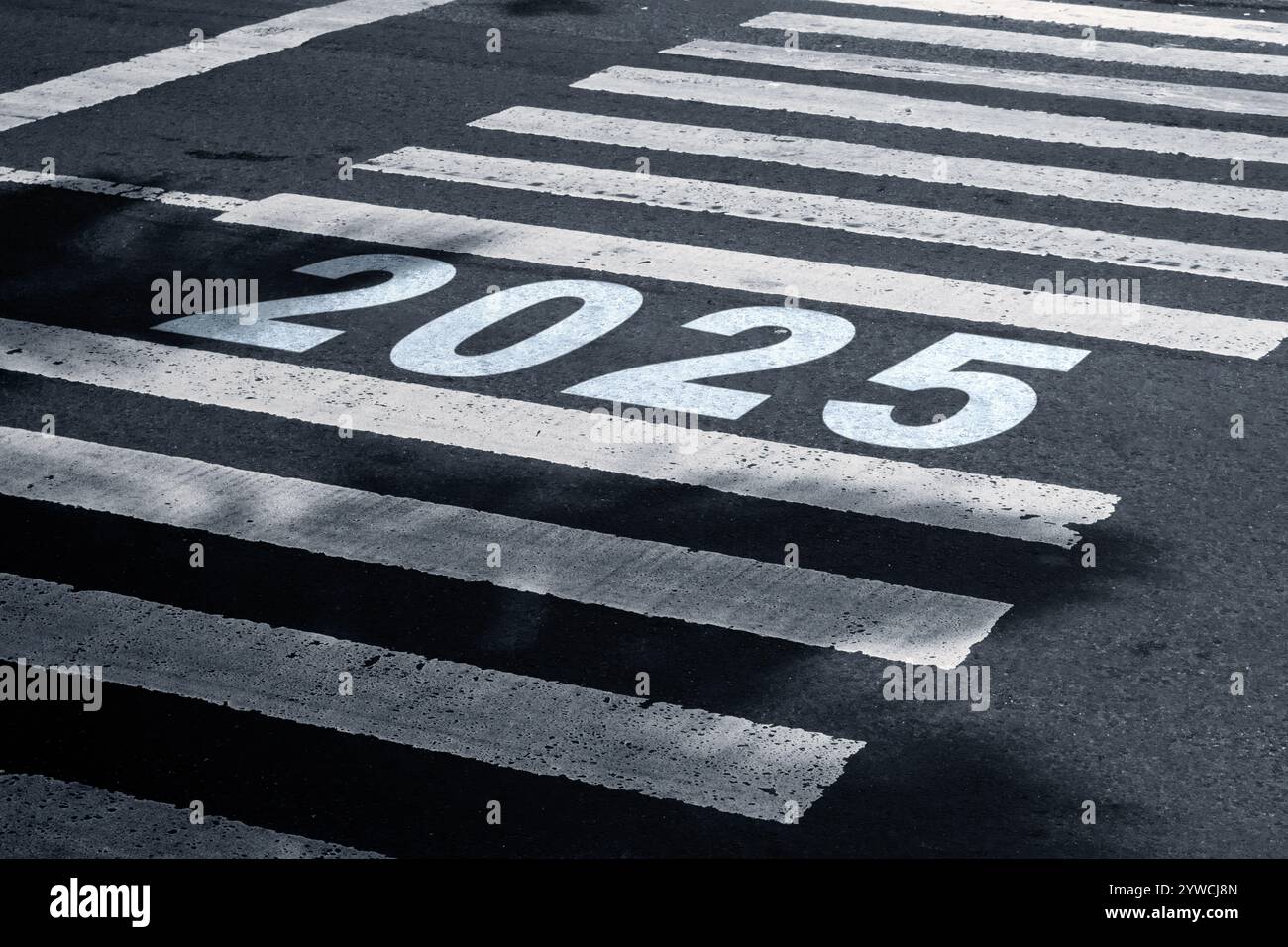 2025 number written on the pedestrian crosswalk on asphalt road