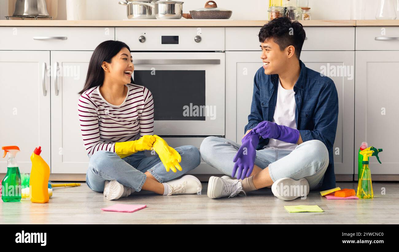 Getting Clean Beautiful asian couple getting ready for cleaning kitchen Stock Photo ...