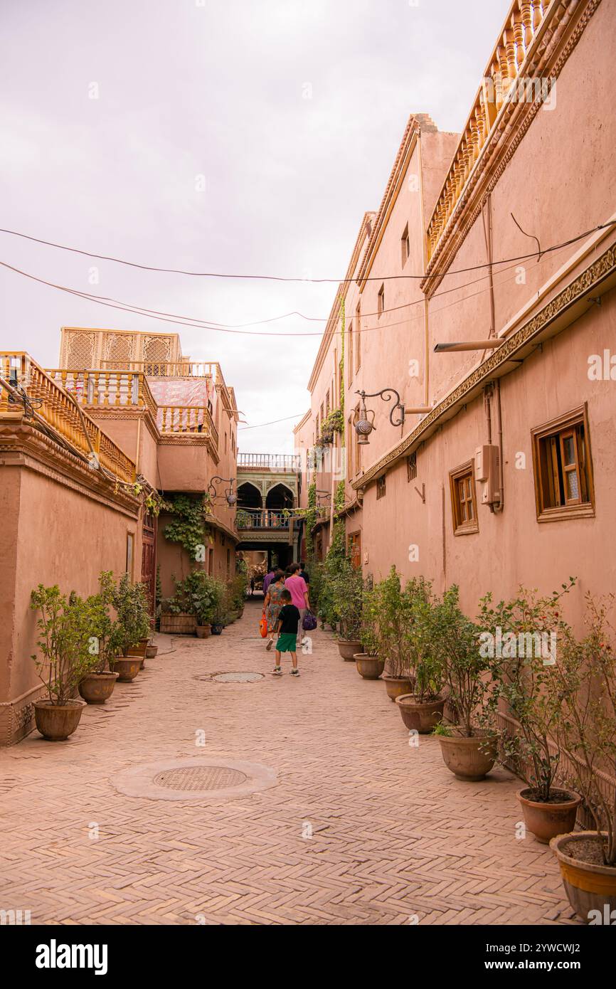 Kashgar, Xinjiang, China - JULY, 17, 2023: The old women wearing traditional Xinjiang clothes in Kashgar Ancient City Stock Photo