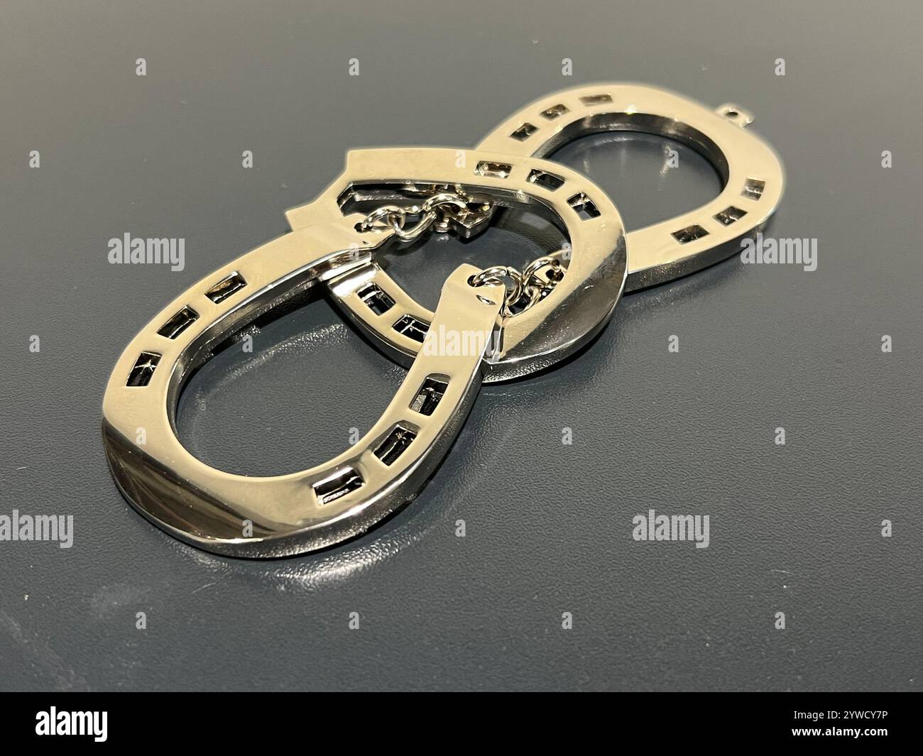 Huzzle puzzle game, purpose is to disassemble assemble the units. Made of cast metal alloy, high quality product, entertain to kill time. - Smartphone Captured Stock Image