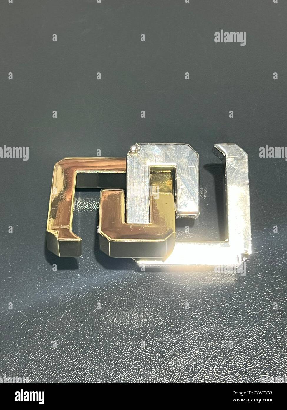 Huzzle puzzle game, purpose is to disassemble assemble the units. Made of cast metal alloy, high quality product, entertain to kill time. - Smartphone Captured Stock Image