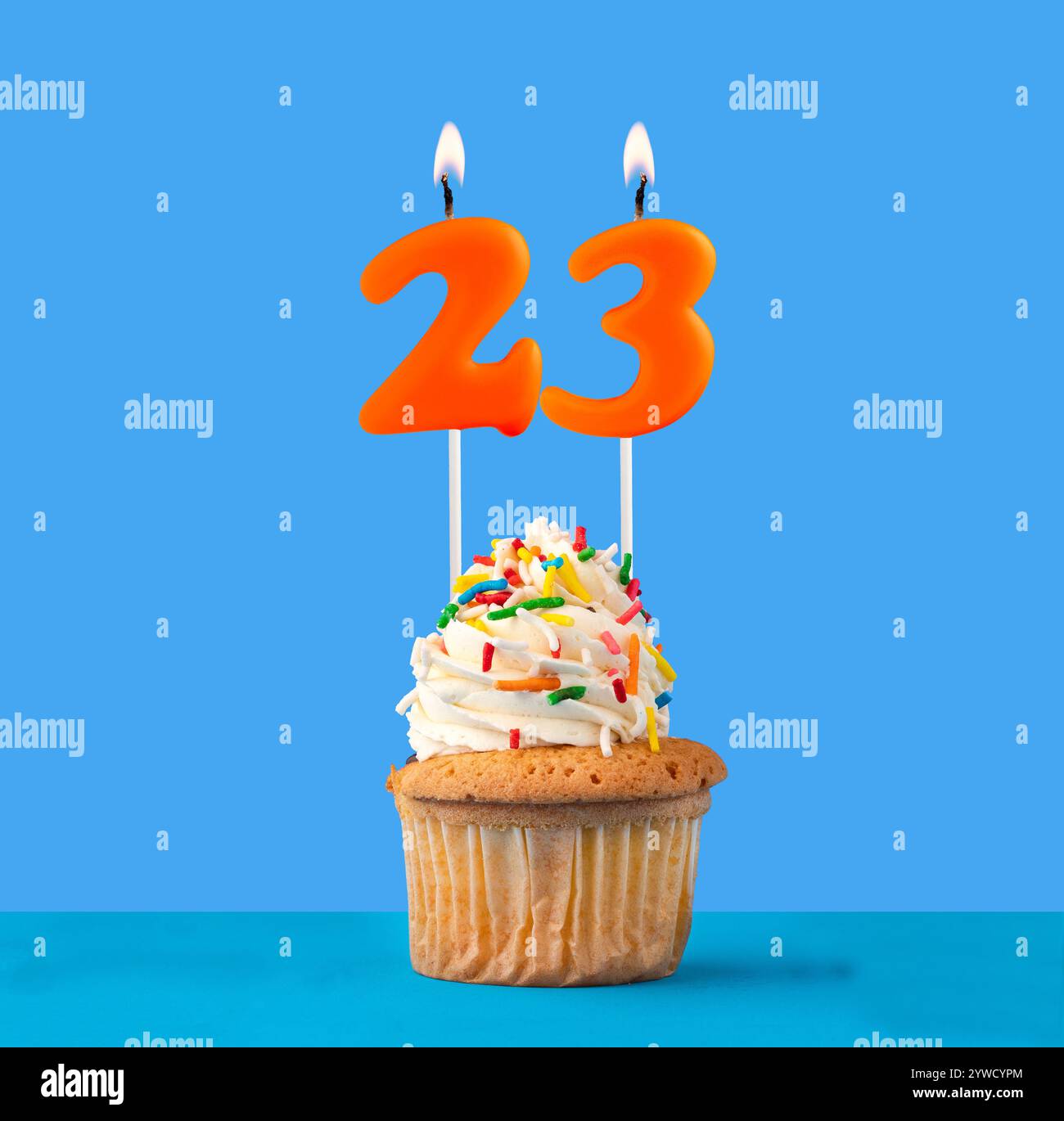 Orange birthday candle and cupcake - Number 23 Stock Photo - Alamy