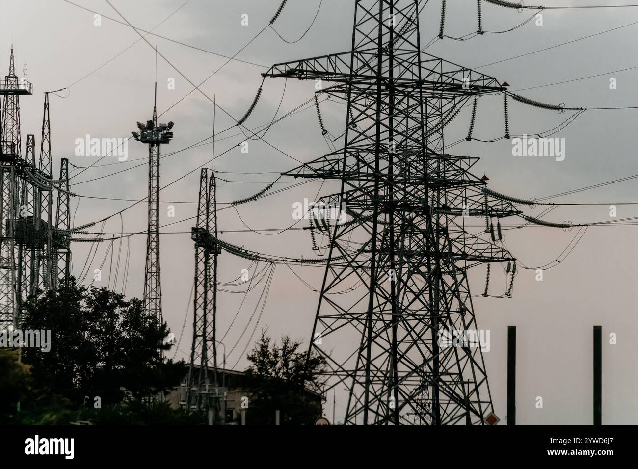 Power Lines and Towers Under a Cloudy Sky Stock Photo - Alamy
