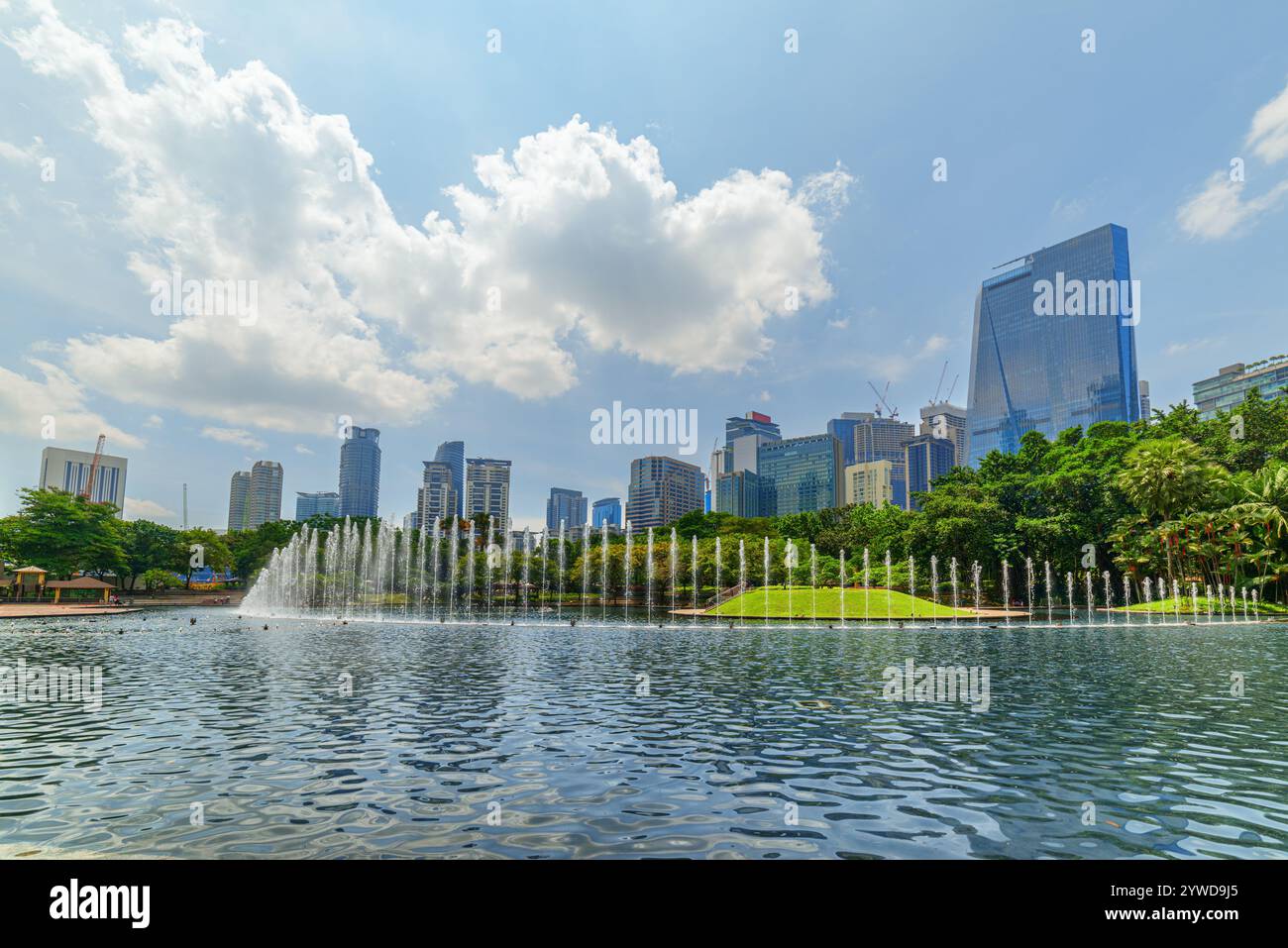 Scenic fountains in a green urban park of Kuala Lumpur Stock Photo - Alamy