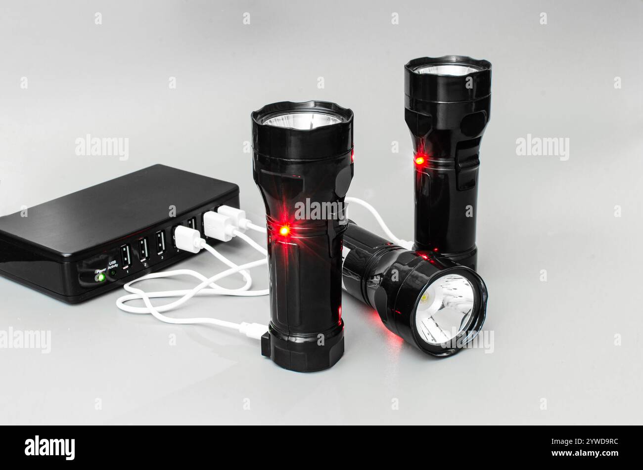 Charging Led Flashlight Via Usb Hub Stock Photo Alamy