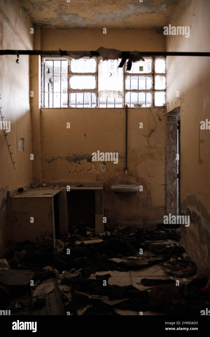 Humane Slaughter Prison Clothes belonging to former detainees scattered across the floor inside ...