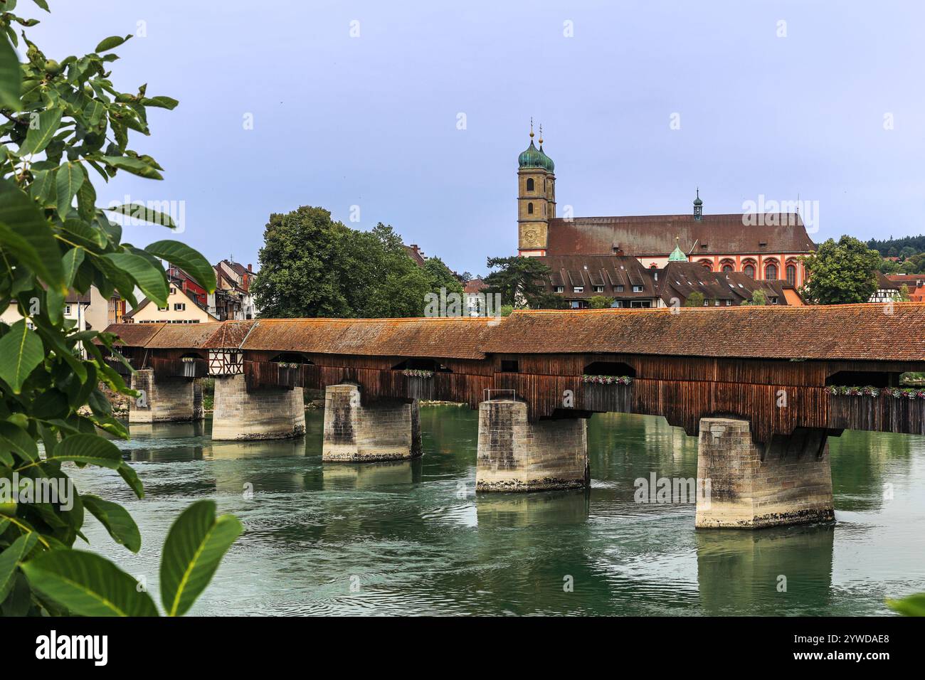 The Rhine with the historic wood bridge and Fridolins munster in Bad Saeckingen in summer, Germany Stock Photo