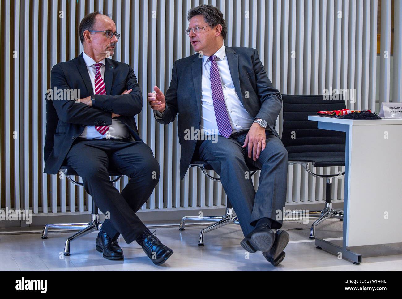 Schwerin, Germany. 11th Dec, 2024. Wolfgang Blank (l), the new Economics Minister of Mecklenburg-Vorpommern, sits with his predecessor, Reinhard Meyer (SPD), in the plenary chamber before his swearing-in ceremony. The non-party businessman and former President of the Neubrandenburg Chamber of Industry and Commerce took his oath of office and gave his first speech on economic prospects. Credit: Jens Büttner/dpa/Alamy Live News Stock Photo