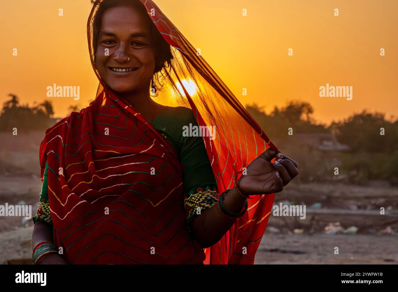 Local woman at the sunrise in Rann of Kutch, Gujarat, India Stock Photo