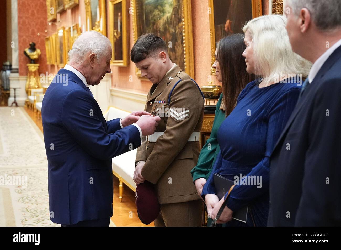 Corporal Richard Hayes, The Parachute Regiment, is decorated with the King's Commendation for Bravery by King Charles III, during an Investiture ceremony at Buckingham Palace in London. The award recognises Corporal Hayes single-handedly wrestling an individual armed with a knife to the ground and disarming him as he headed towards a National Education demonstration, in Central Birmingham on 1 February 2023. Picture date: Wednesday December 11, 2024. Stock Photo