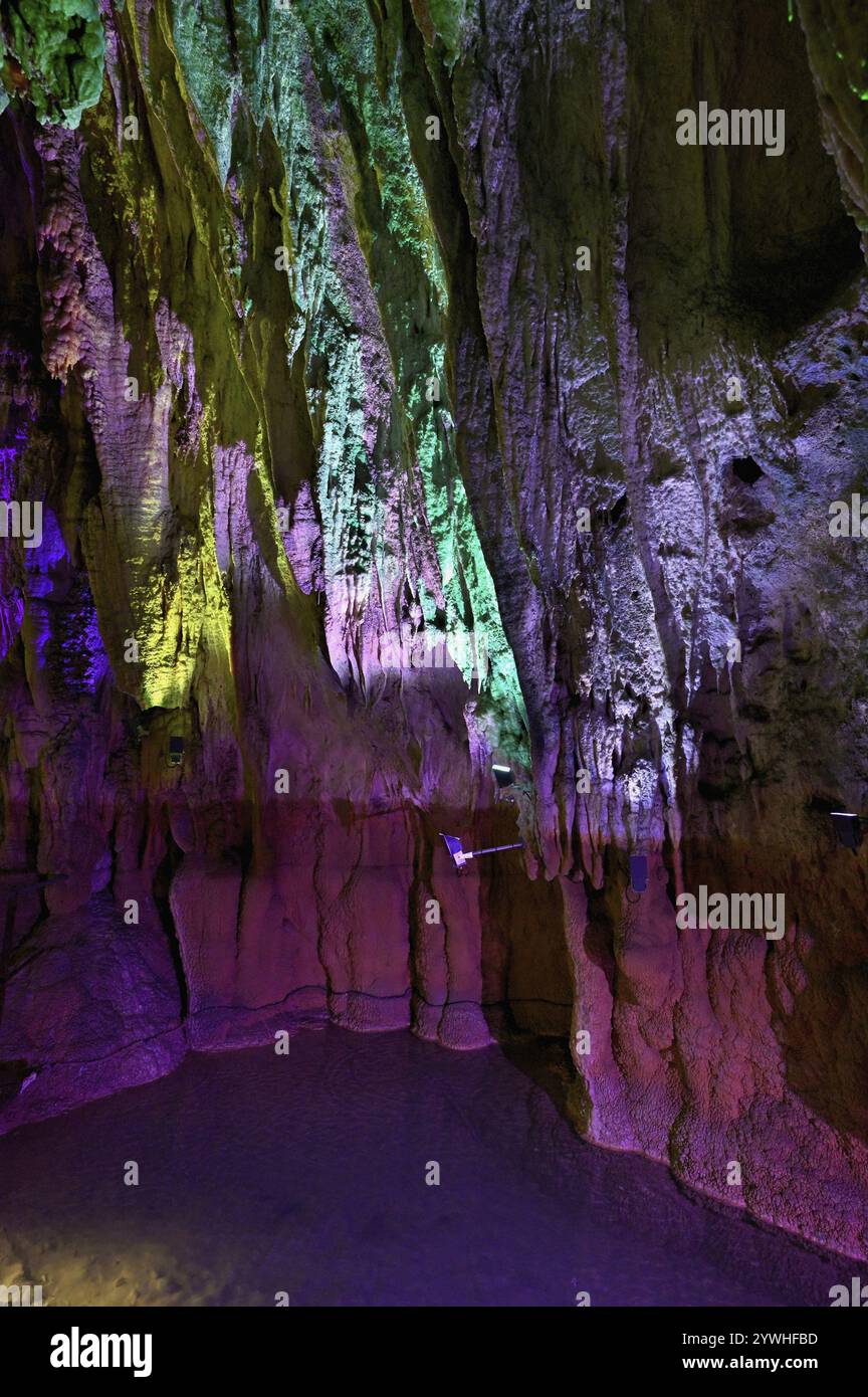 Stalactites illuminated by coloured LED light, stalactite cave ...