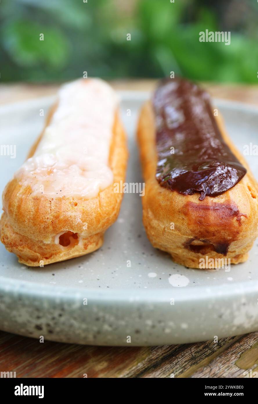 Closeup of Delectable Vanilla and Chocolate Eclairs Stock Photo