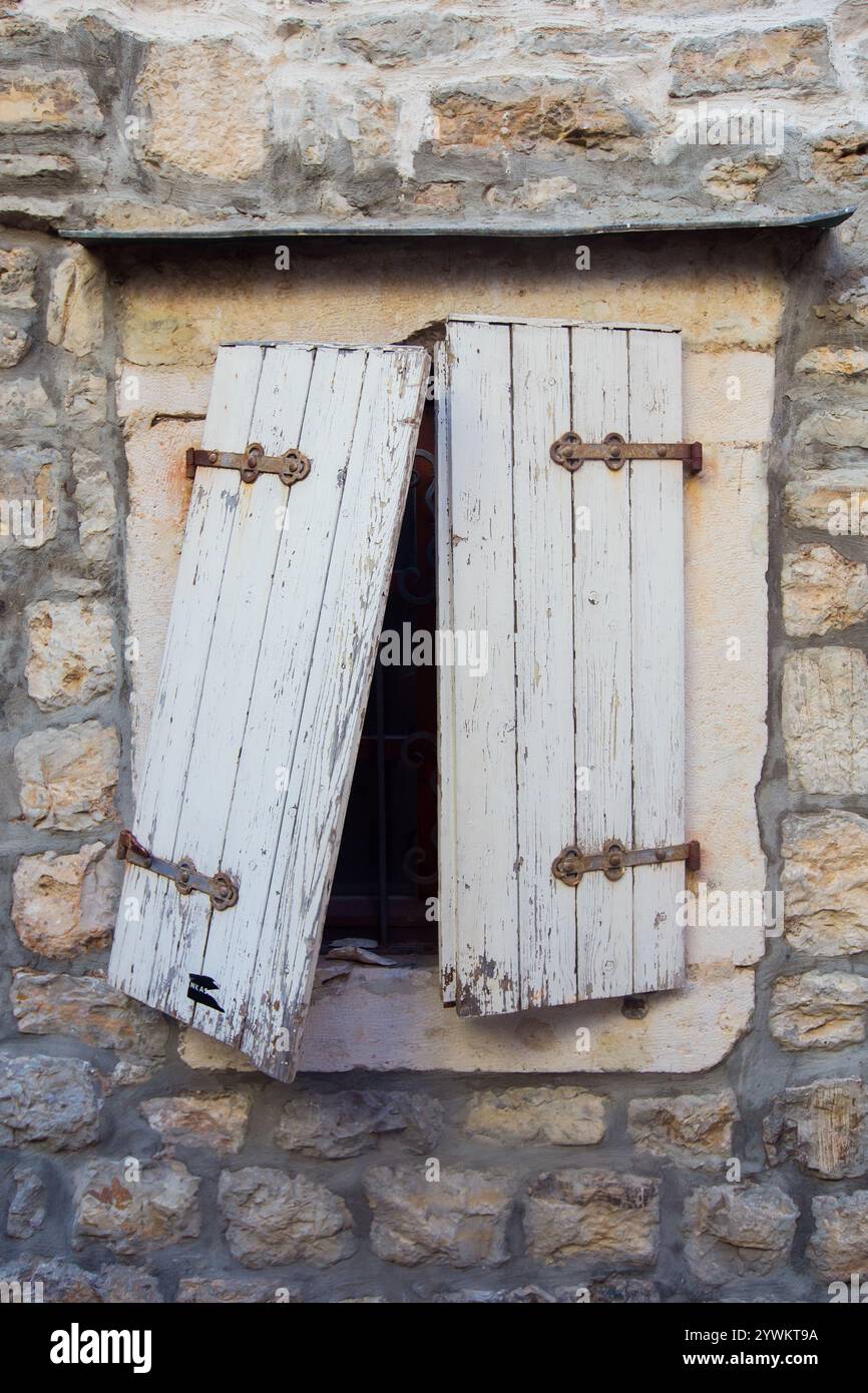 Broken old window in Budva, Montenegro Stock Photo
