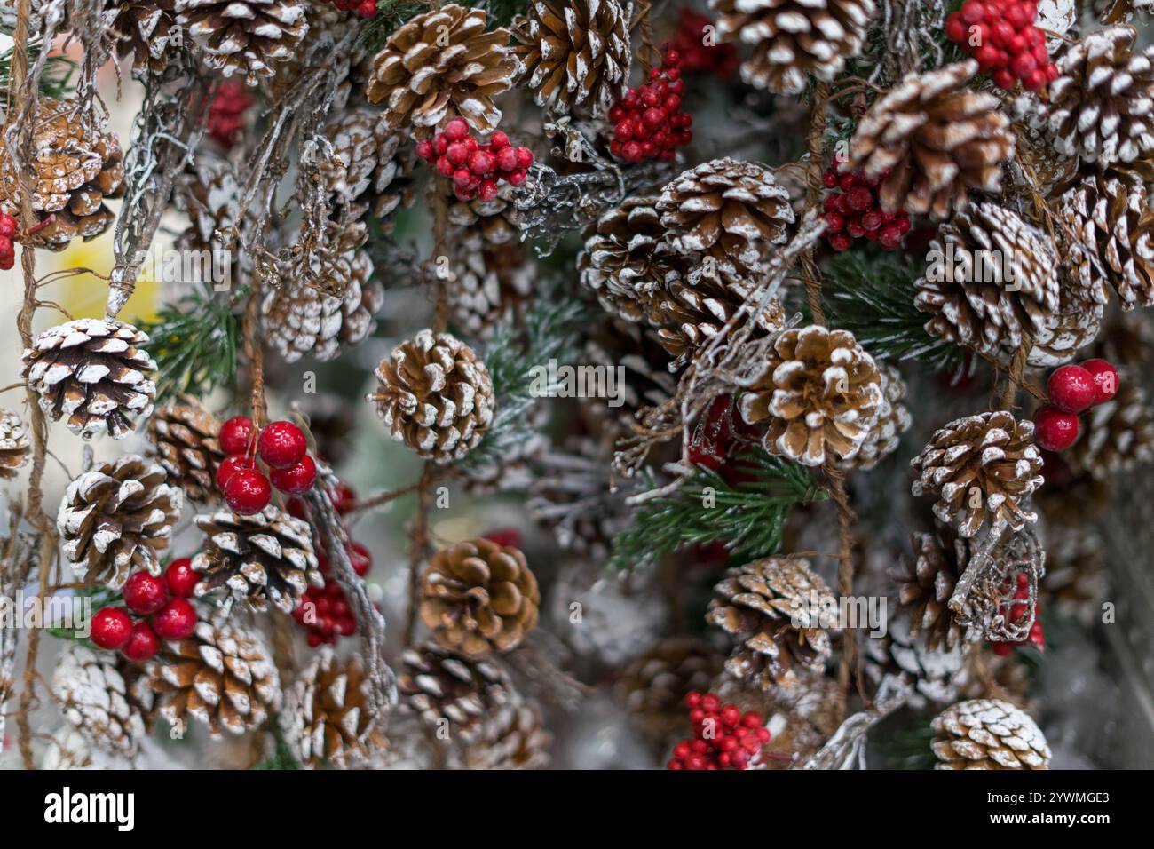 Christmas decoration made of pine cones and red berries Stock Photo - Alamy