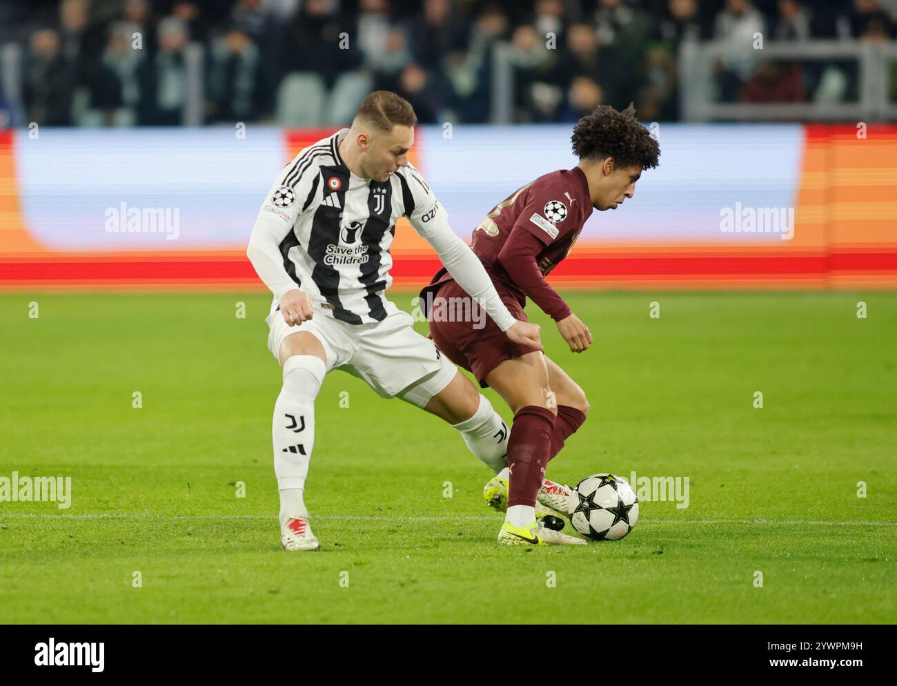 Turin, Italy. 11th Dec, 2024. Teun Koopmeiners of Juventus FC and Jack Grealish of Manchester City during the Uefa Champions League 2024/25, football match between Juventus FC and Manchester City, on 11 December 2024, at Allianz Stadium Turin Italy. Credit: Nderim Kaceli/Alamy Live News Stock Photo