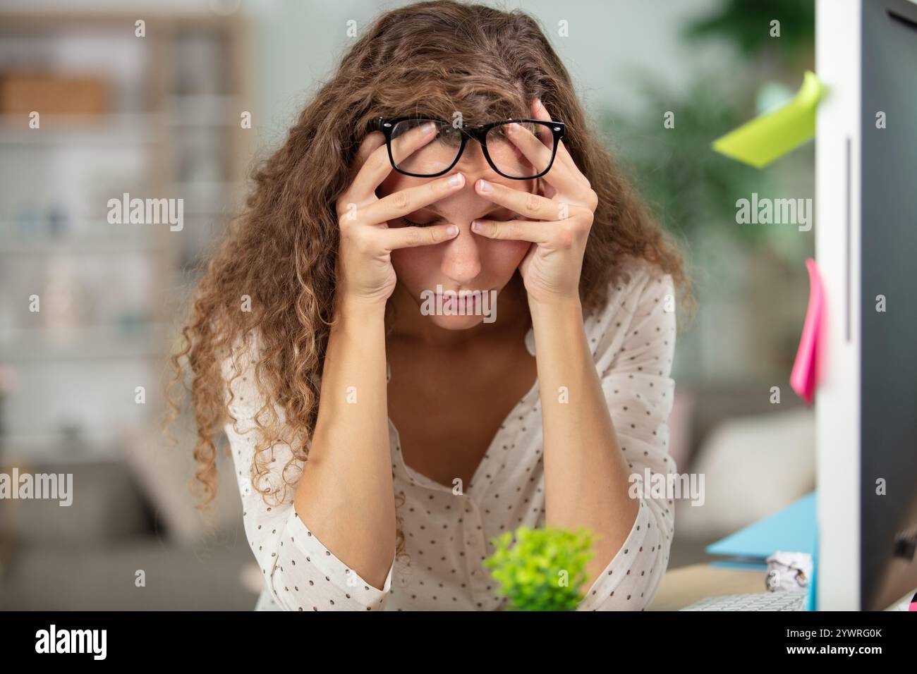 Distressed woman head in hands hi-res stock photography and images - Alamy