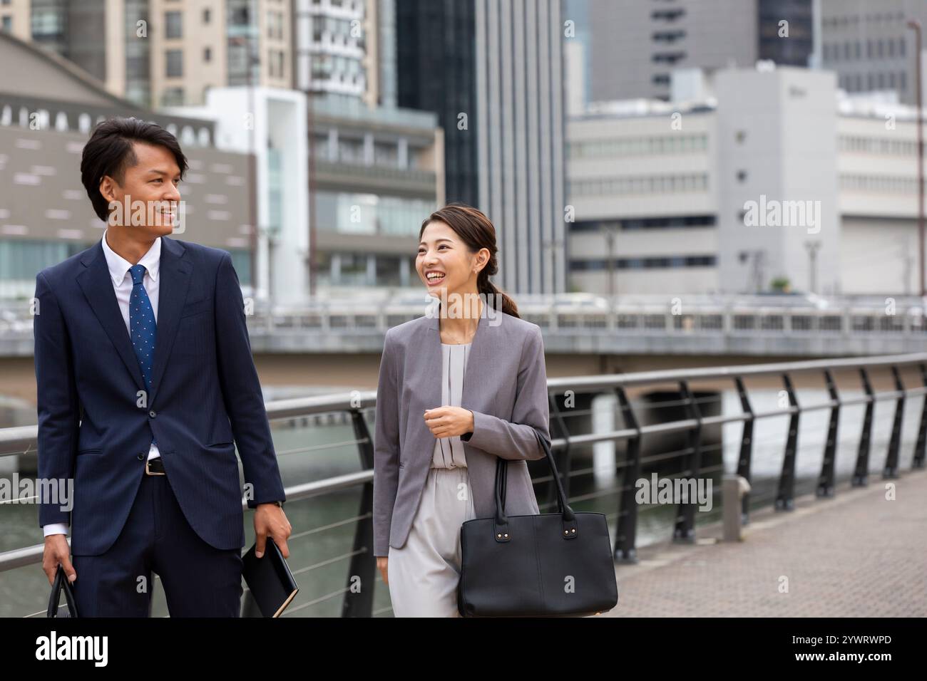 Two japanese businessmen walking hi-res stock photography and images ...