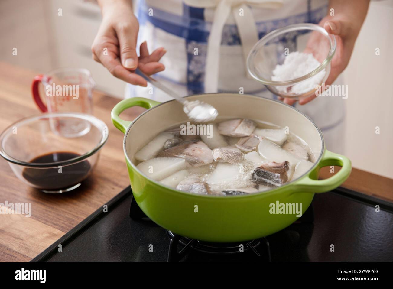 Woman adding spoon sugar hi-res stock photography and images - Alamy
