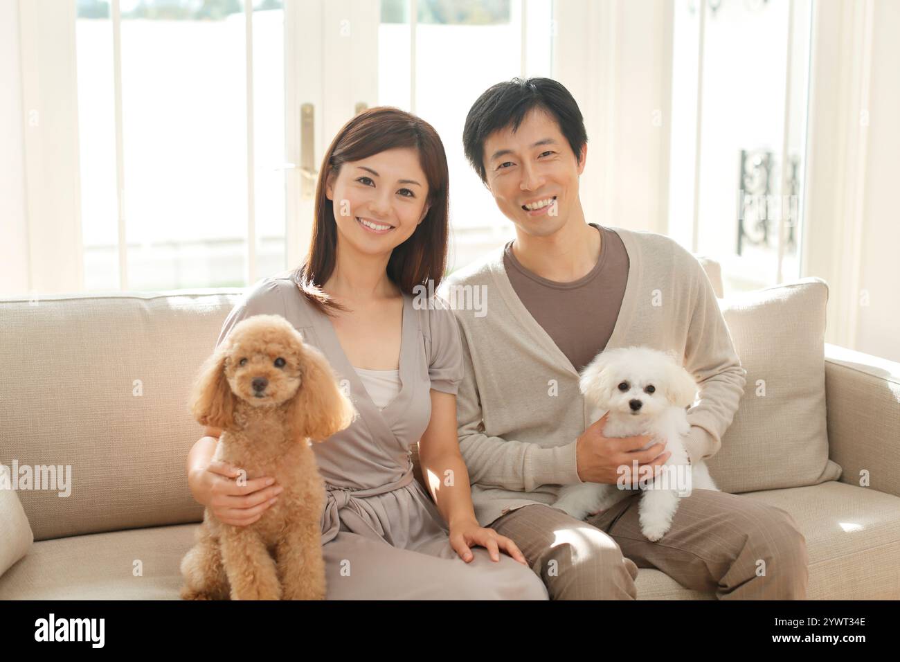 Positive family couple dog hi-res stock photography and images - Alamy