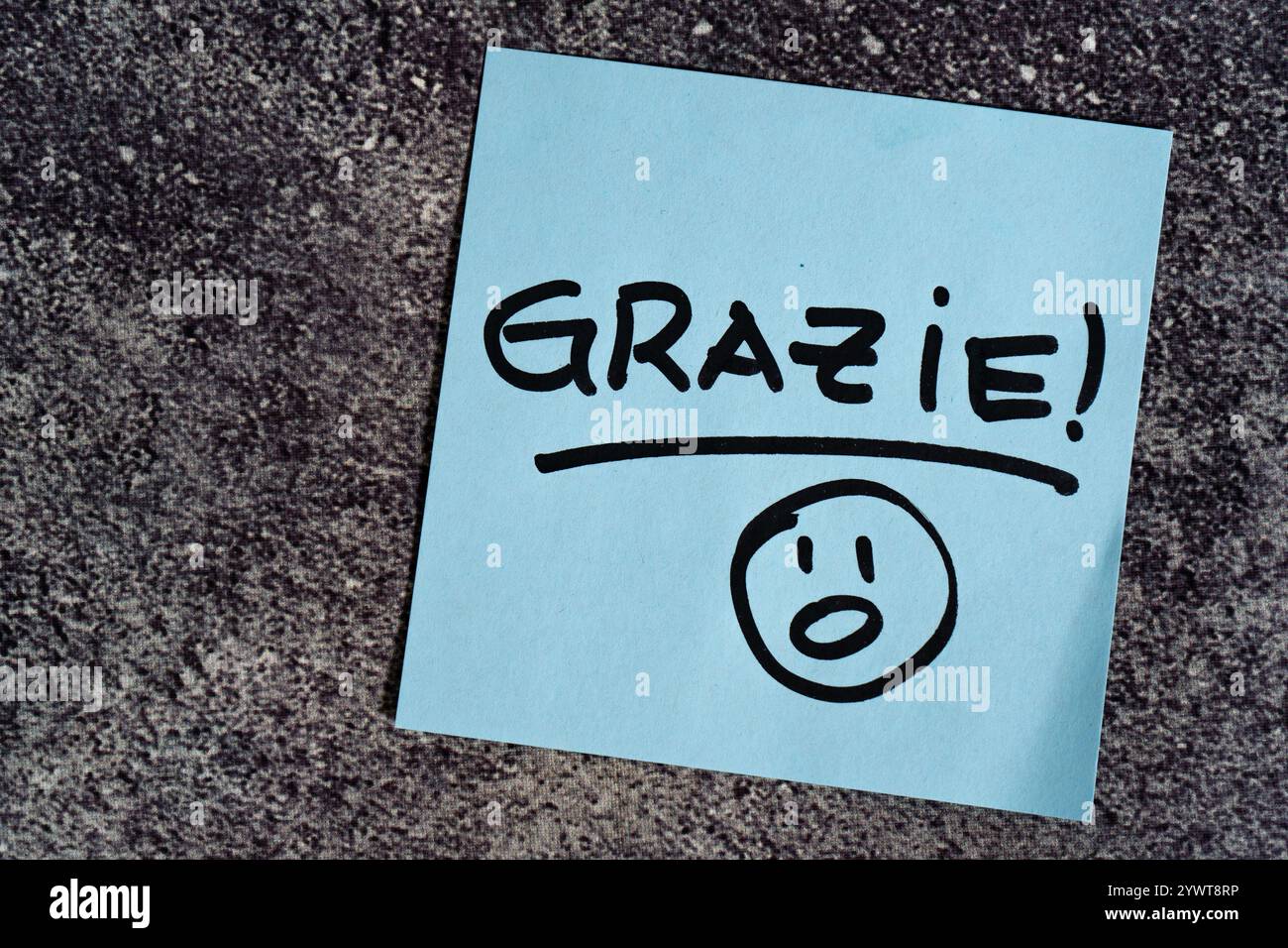 Thank you written on a post-it or note. Stock Photo