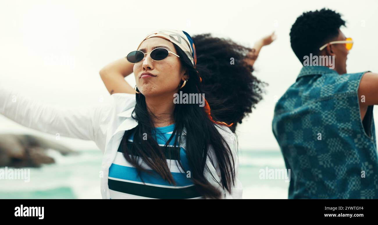 Woman, friends and dancing on beach outdoor with energy, movement and ...