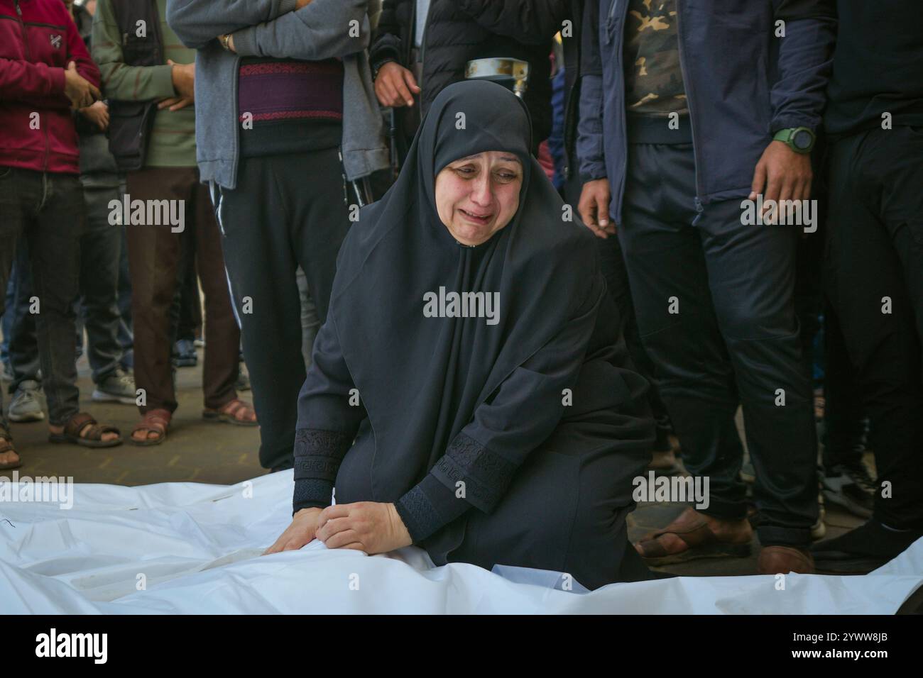 Asma Al Habash, mourns her brother and his family, victims of an ...